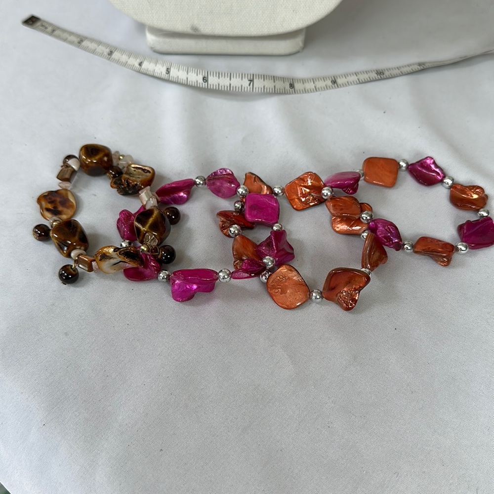 Four stretch shell style bracelets